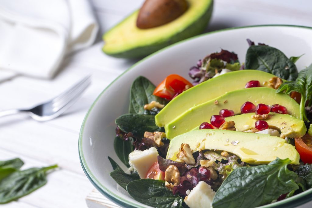 Avocado salad with spinach and pomegranate, diet salad